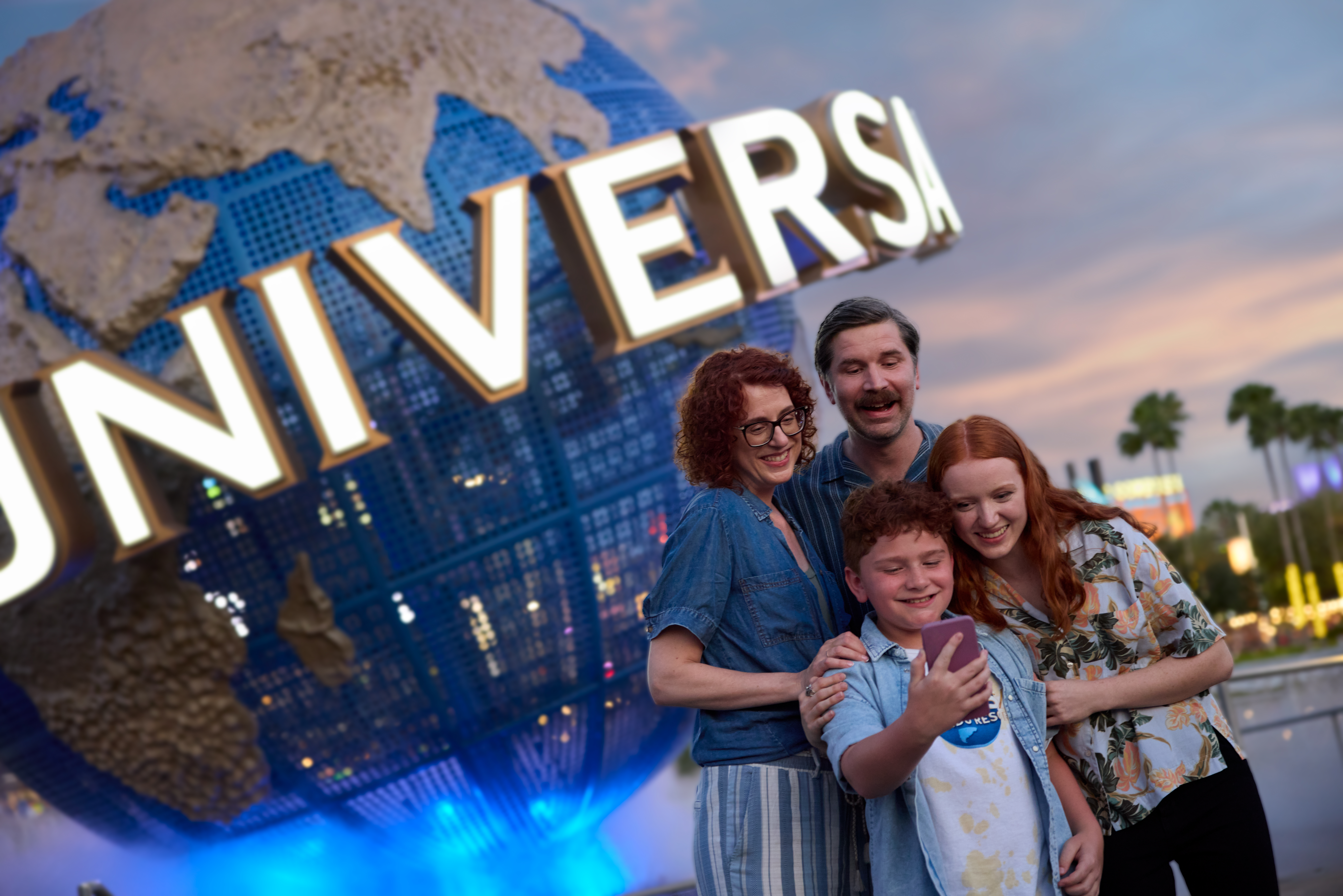Universal Orlando Resort globe with a family of four