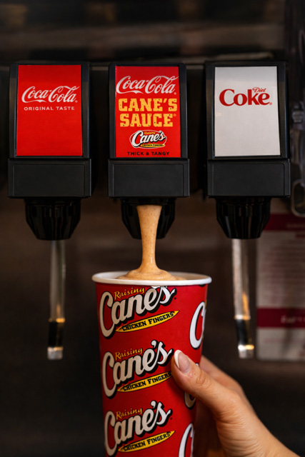 Raising Cane's and Coca Cola soda fountain with cup