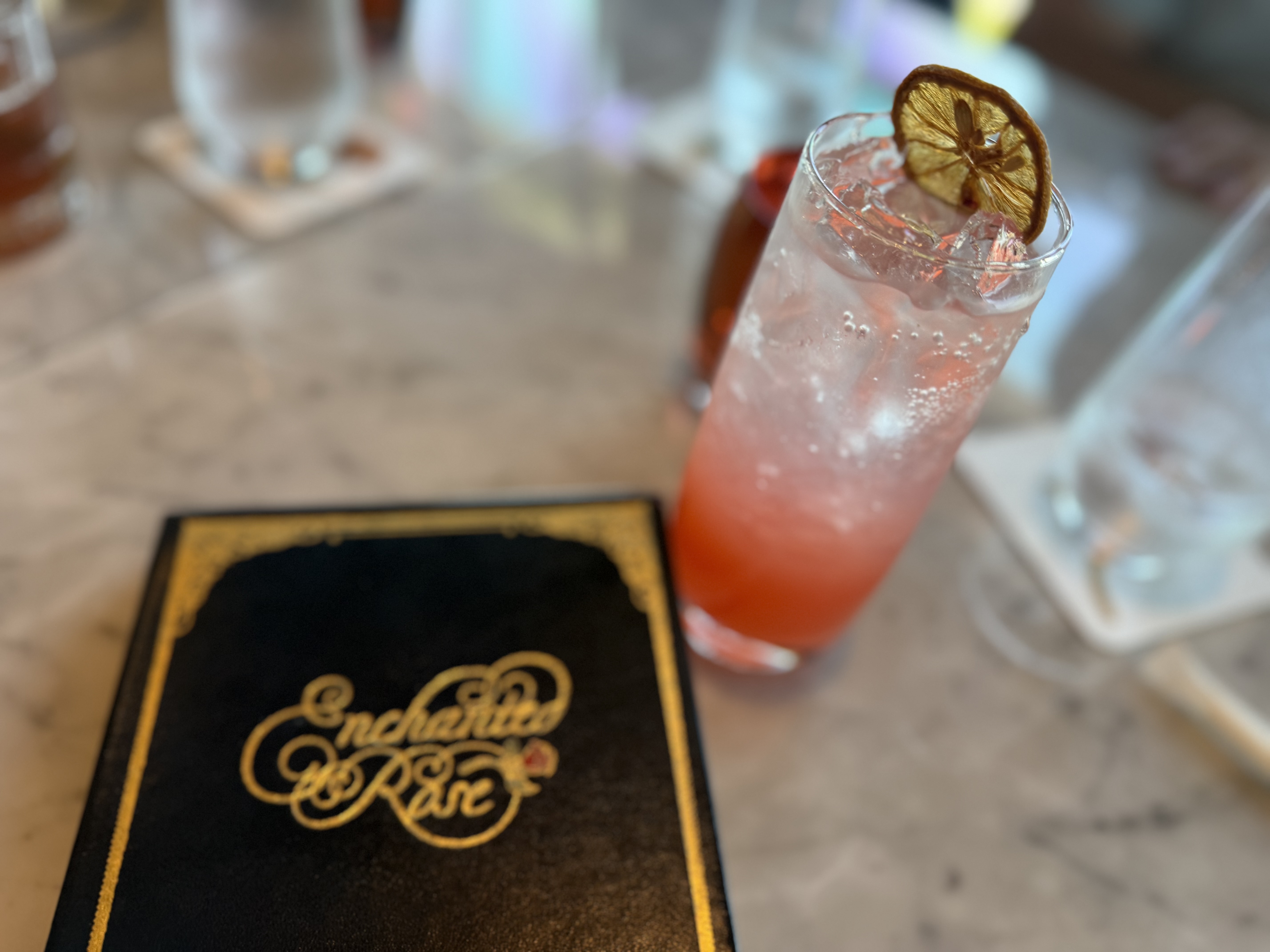 pink cocktail with Enchanted Rose menu