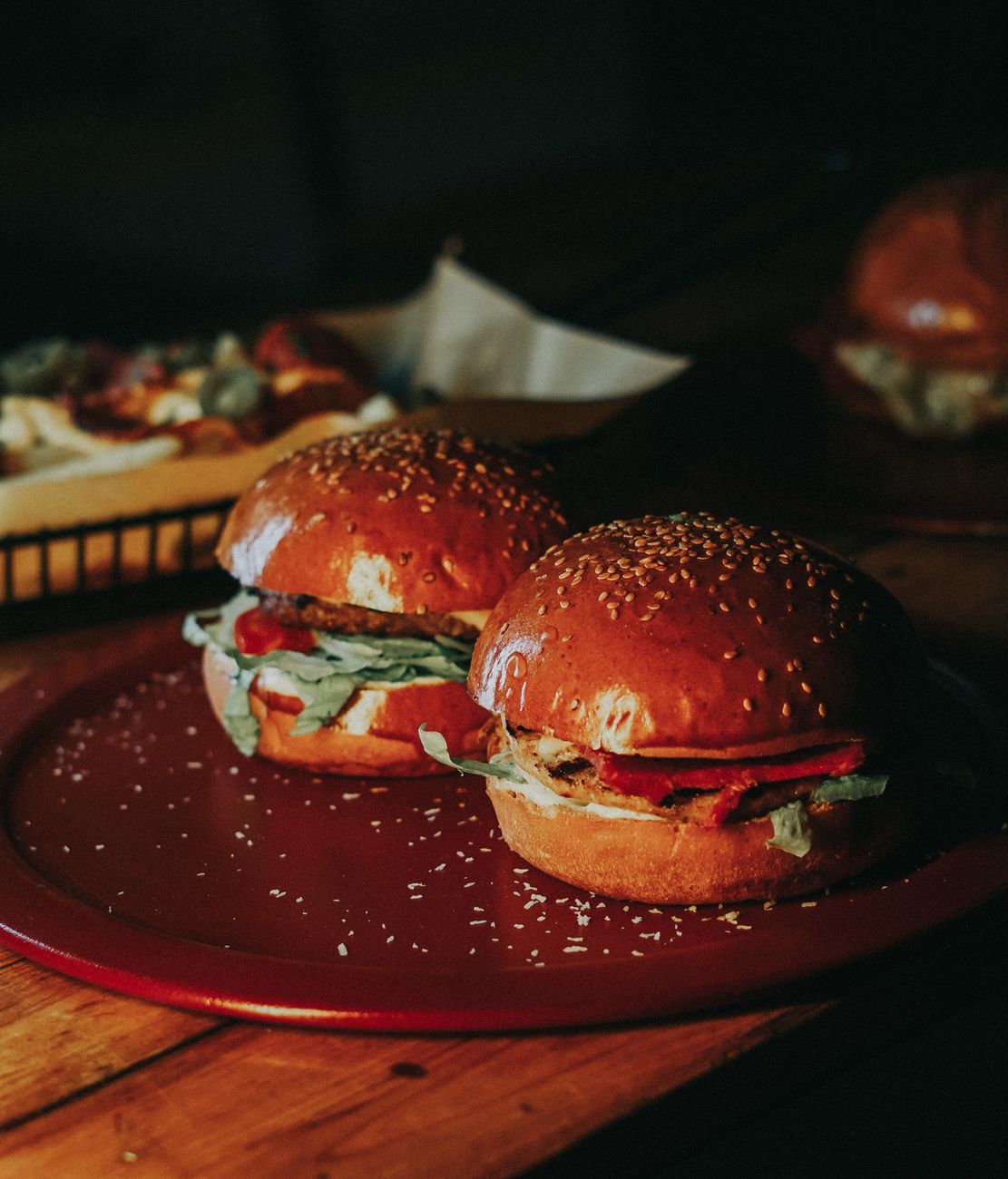 two burgers lying on a plate